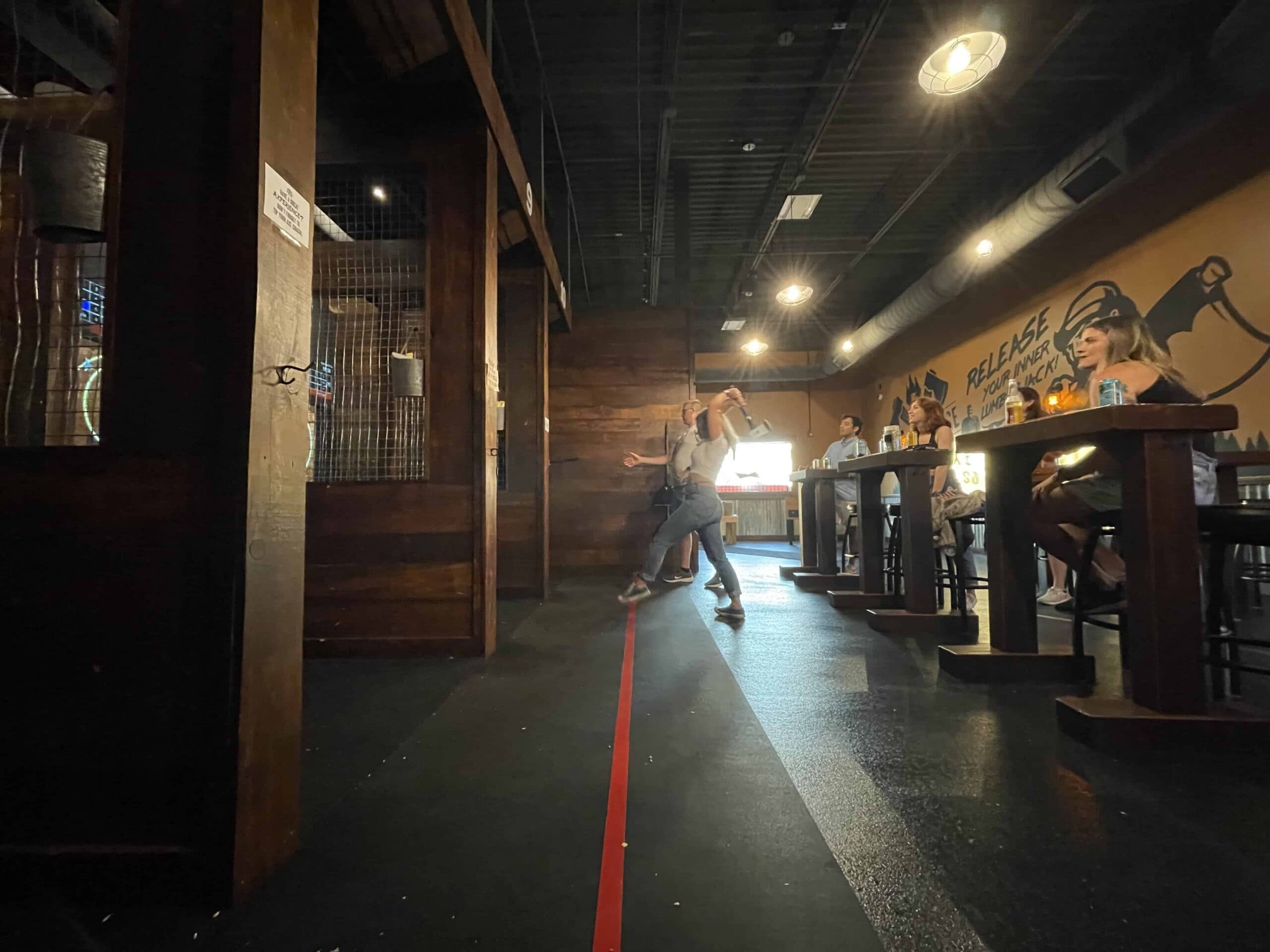 Wooden axe-throwing lanes inside Hatchet House in Bemidji
